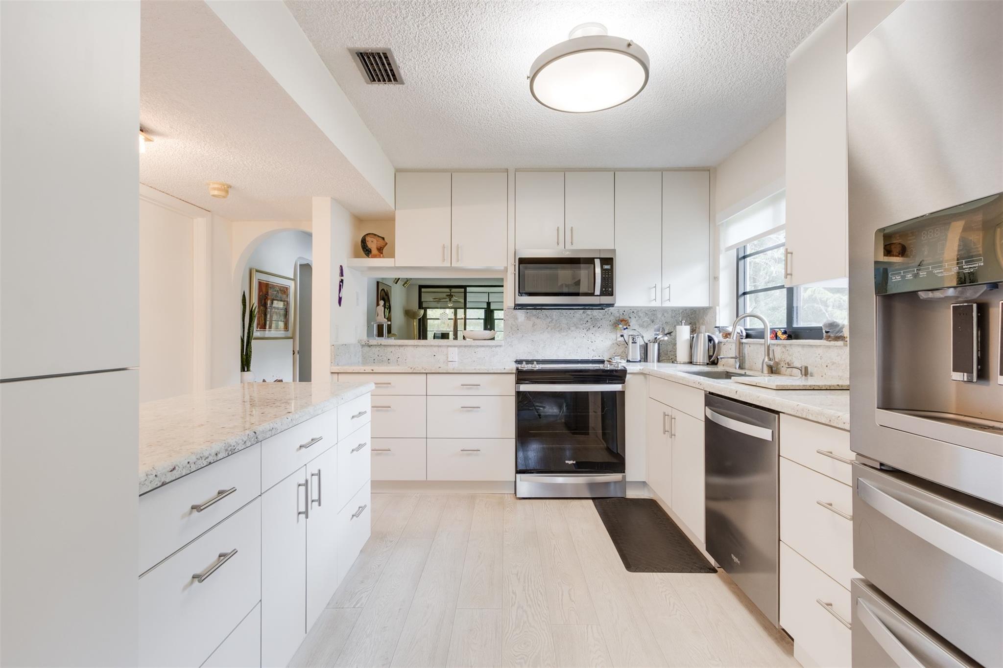 Welcome Home to Your Spacious, Corner 2 Bedroom/2 Bathroom in this ALL AGES GATED Community. This Unit has Both a Front Patio and an Enclosed Balcony. Features includes 2 Walk-In Closets in the Master Bedroom; a Separate Laundry Room; Updated Kitchen, Updated Flooring throughout the Common Rooms and Lots of Natural Light. Association Dues includes basic cable. The community is wired with fiber optic for high-speed internet. No Pets. No Rentals.