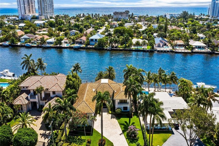 DIRECT INTRACOASTAL custom renovation completed in 2017 on this gated estate on oversized 13,821 SF Lot. Enter to walls of windows and soaring ceilings where expansive living spaces capture magnificent views overlooking pool deck and Intracoastal. Enjoy the daily boat parade from this 155 ft deep property with 92' of waterfront and new dock.  Glass-enclosed, temperature controlled 200+ bottle wine room. Primary suite spans 1500+SF with lounge/sitting area, dressing room, spa bath and balcony with direct water views. Whole house generator, natural gas on property, raised sun deck with multiple outdoor seating and entertaining areas. Walking distance to newly renovated Atlantic Beach area with state-of-the-art fishing pier, enjoy oceanfront restaurants, shops & entertainment venues