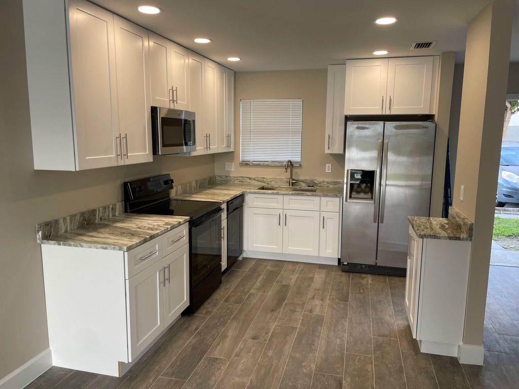 Photo of 2504 Seaside Drive, Greenacres, FL 33463 (MLS # R11152668)