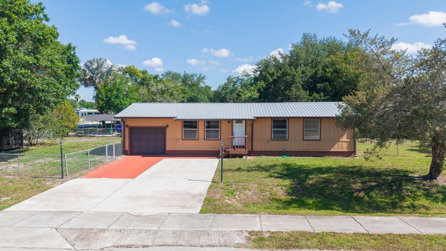 Why rent when you can own? Welcome to this fully updated 3-bedroom, 1.5-bath home offering 1,056 sq ft in the desirable SW section of Okeechobee. Location matters—and this one delivers. Just a short walk to Central Elementary, a couple blocks from SW Park Street's shops and restaurants, and minutes from Flagler Park and Lake Okeechobee, you're right in the middle of everything. Inside, the heavy lifting is already done. This home features a metal roof, new HVAC, new water heater, updated flooring, and a fully renovated kitchen with new cabinets, countertops, and appliances. Fresh interior and exterior paint make it truly move-in ready—no projects, no surprises. Step outside to a fully fenced yard with dual gate access—perfect for storing boats or a safe place for the kids and pets.
