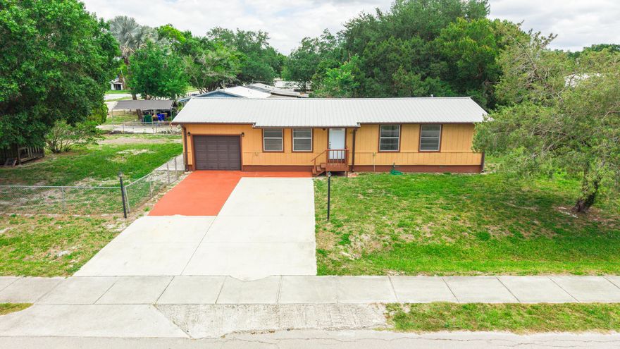 Why rent when you can own? Welcome to this fully updated 3-bedroom, 1.5-bath home offering 1,056 sq ft in the desirable SW section of Okeechobee. Location matters—and this one delivers. Just a short walk to Central Elementary, a couple blocks from SW Park Street's shops and restaurants, and minutes from Flagler Park and Lake Okeechobee, you're right in the middle of everything. Inside, the heavy lifting is already done. This home features a metal roof, new HVAC, new water heater, updated flooring, and a fully renovated kitchen with new cabinets, countertops, and appliances. Fresh interior and exterior paint make it truly move-in ready—no projects, no surprises. Step outside to a fully fenced yard with dual gate access—perfect for storing boats or a safe place for the kids and pets.