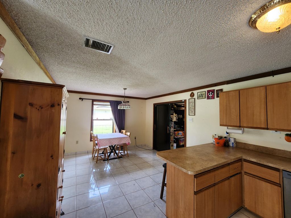 Photo of 1821 SE Dranson Circle, Port Saint Lucie, FL 34952 (MLS # R10958295)