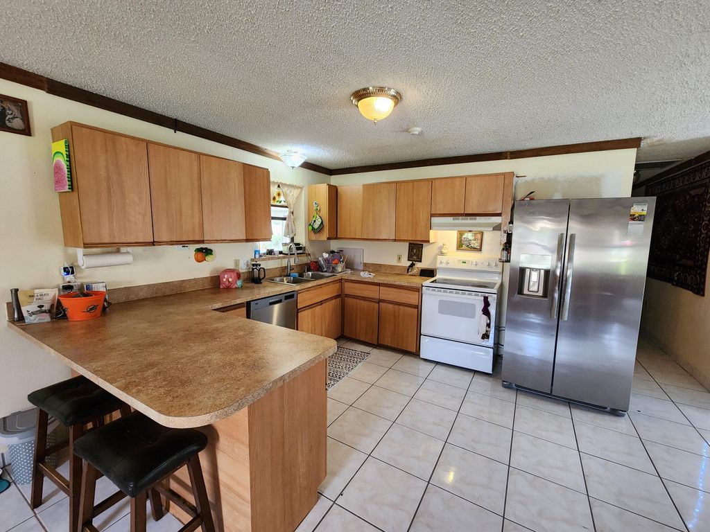 Photo of 1821 SE Dranson Circle, Port Saint Lucie, FL 34952 (MLS # R10958295)