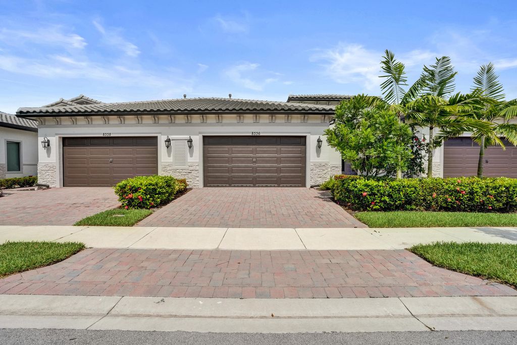 Photo of 8336 W Blue Spring Drive, Parkland, FL 33067 (MLS # B26035088)