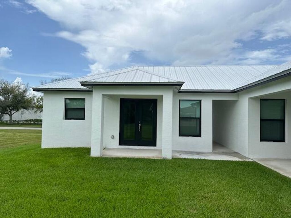 Photo of 85 Pinewood Lane #B, Fort Pierce, FL 34947 (MLS # R10909692)