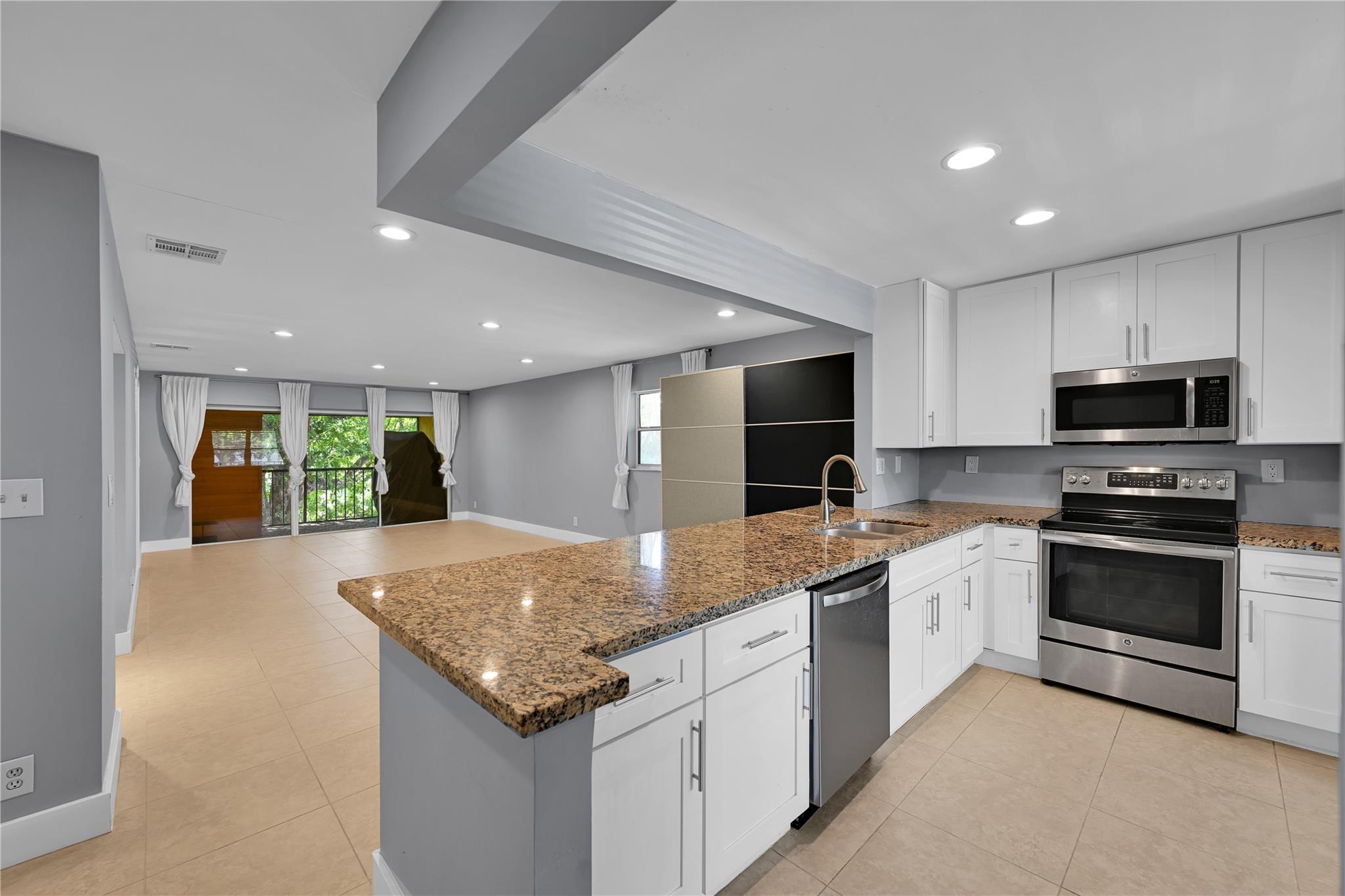 Super location, this updated condo has all the amenities to make this unit the ideal rental. Spacious open layout with split bedrooms for extra privacy. Beautiful renovated kitchen with all stainless steel appliances and washer dryer. Large primary suite has walk in closet, double sinks with walk-in shower. Access to walk up attic for extra storage. Double Sliders off the living room lead out to screened in patio with sauna and treadmill for your own personal "spa" like atmosphere. Whole Foods, FAU, and major restaurants right down the street. Easy proximity to Boca Town Center Mall, Mizner Park. Conveniently located off major interchanges for easy commuting. Cable & water included in rent. Landlord requires 690+ credit score and 2.5x gross rent income verification.