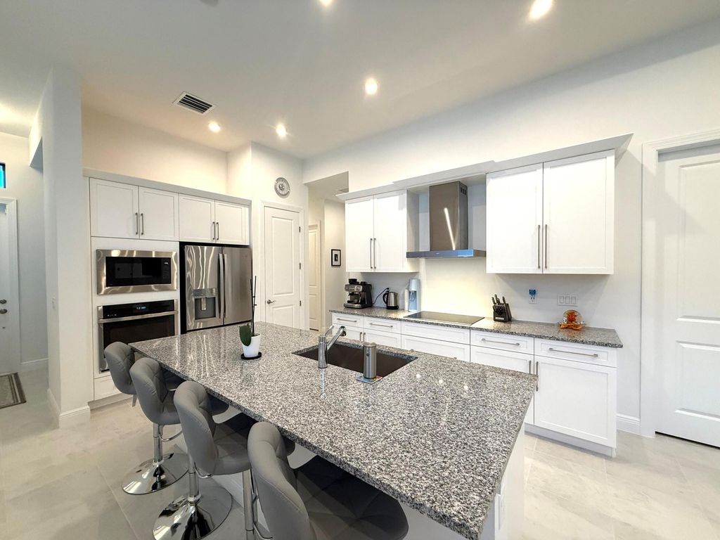 Photo of 187 SE Via Sangro, Port Saint Lucie, FL 34952 (MLS # B26010247)