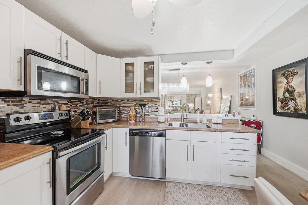 Photo of 2301 Lucaya Lane #M2, Coconut Creek, FL 33066 (MLS # B26014079)