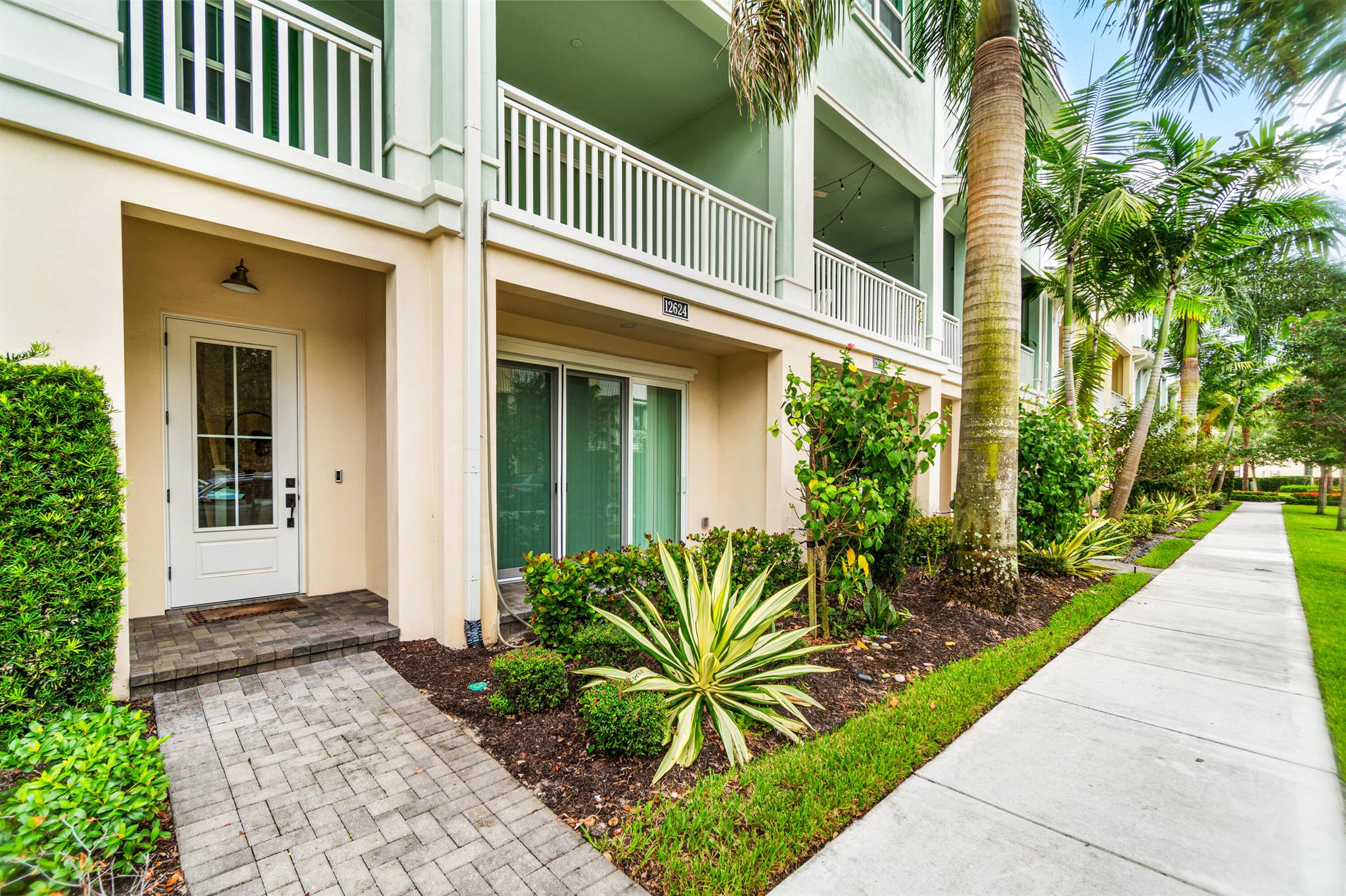 Exceptional 4 bedroom, 3.5 bath townhome covering over 2,250 sf of living space and built in 2021, this home features a fabulous open floorplan with many exquisite and custom upgrades. When entering this amazing townhome, walk in the first floor and enjoy a private bedroom or office with outdoor space and a full bathroom for guests. On the second level, the kitchen boasts an oversized quartz island and 2 walls of cabinetry plus pantry providing the perfect place to live and entertain. Kitchen opens to the great room living area adorned with beautiful porcelain plank tile and oversized balcony to enjoy and relax. The 3rd floor Primary Bedroom impresses with a spacious bathroom with double vanity sinks, expansive and stunning glass, modern open shower, large walk-in closet, plus bonus