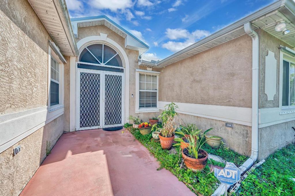 Photo of 1732 SW Lexington Drive, Port Saint Lucie, FL 34953 (MLS # R10937618)