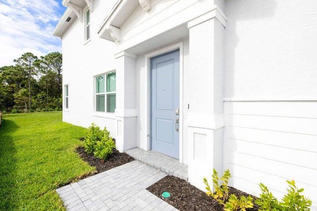 Photo of 824 SE Grovebush Lane, Port Saint Lucie, FL 34984 (MLS # R11095983)