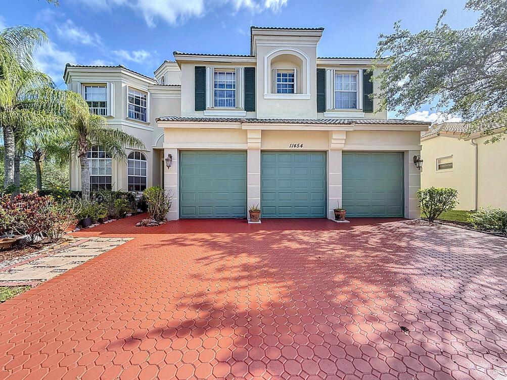 Spectacular 6 bedroom 5 and a half bath located in the exclusive Town Park at Tradition! This beautiful home has been custom painted by the owner, a master craftsmen. This is one of the largest models in Town Park at over 4200 square feet of living space. You will be in awe as soon as you enter and view the foyer tower that is over 20 feet high and the massive staircase, also custom painted. The home is located on an oversized CORNER LOT in the Fieldstone section of Town Park. The HOA fee includes basic cable with HBO, high speed internet, monitored security alarm, phone land line, manned security gate, clubhouse and MORE! Don't miss your chance to own this mini mansion in one of the best neighborhoods in Port St Lucie!