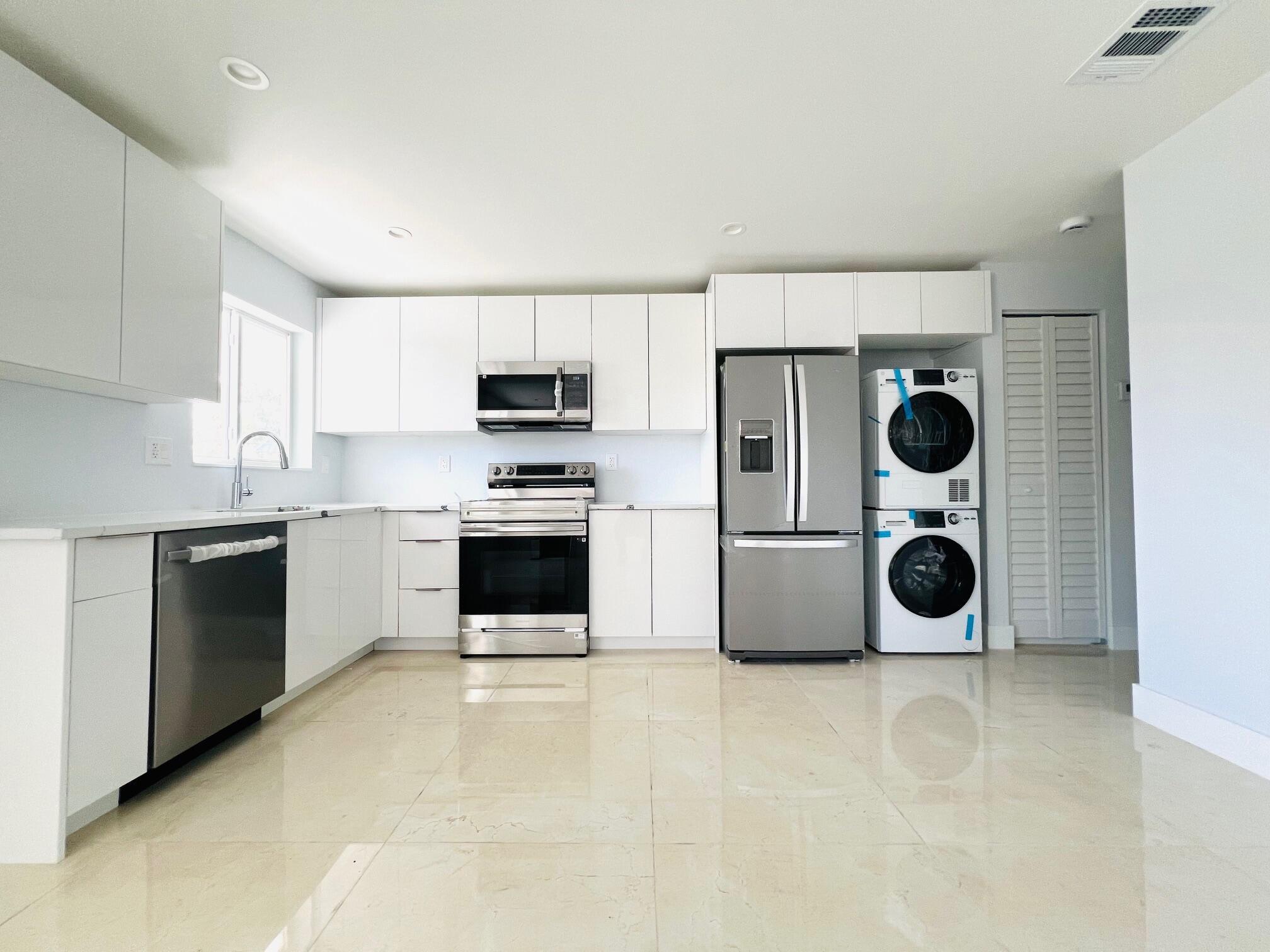 LOCATION,, Just two blocks south of Atlantic Ave. this condo allows you to experience the stylish vibe of Downtown Delray Beach. Modern style meets vibrant city living! This completely remodeled 1 bedroom 1 bath condo offers the perfect blend of convenience and entertainment. All brand-new stainless steel appliances, quartz countertops, and custom cabinetry with a spacious layout for a bright and open living space with lots of natural light, updated bathroom The modern Interior was thoughtfully designed with high end finishes, sleek flooring, and equipped with WASHER & DRYER In the Unit for convenience., water is included in rent , tankless water heater, New A/C. All major gyms are within half a mile, Pilates,Yoga, Pure Life, also close to the rooftop pool. ''Live In Downtown Delray