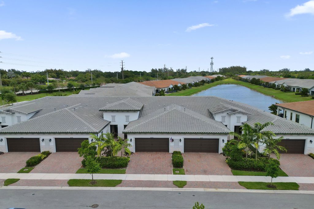 Photo of 8334 W Blue Spring Drive #8334, Parkland, FL 33067 (MLS # B26028311)