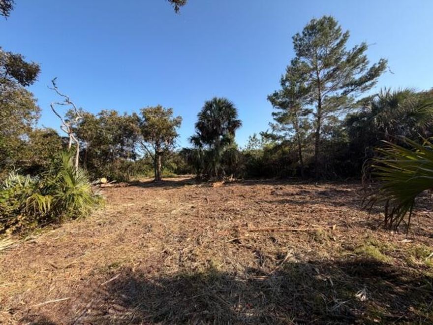 ALL NEW PHOTOS SHOWING CLEARED BUILDING AREA! COUNTY WATER AVAILABLE! Hard to find wooded acreage in convenient location. 2+ acre plot of land in the North Vero area, near multiple golf courses. It's elevated on the sand ridge with numerous hardwood trees. There's no time limit to build and you have freedom to select a builder of your choice. Minimal deed requirements such as 2,500 square feet living and no ultra modern or barndominium homes. This is a great opportunity to design and build your dream home in a scenic location.