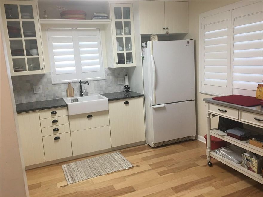 Come see this totally redone unit with no expense spared!Everything has been updated and ready to move in. This is a corner unit with extra windows allowing for great views of the pool and peaceful water views from the large screened patio while you relax enjoying your morning coffee.This unit is located in the heart of Weston with A rated schools and access to the Bonaventure Town Center Club with amazing amenities for a fee of $315 a year! The living area and dining area ceiling to floor partition is not included in the sale . It is available for purchase separately