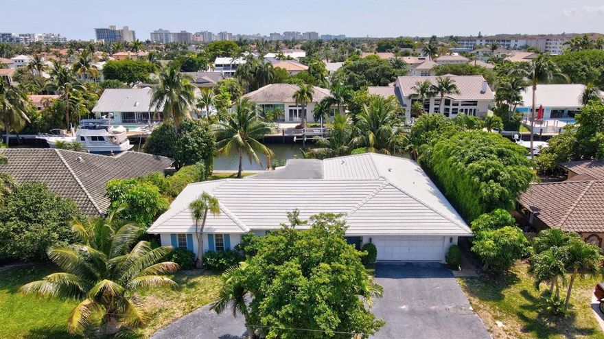 This stunning waterfront home located in the highly sought-after Tropic Isles neighborhood of Delray Beach boasts 4 bedrooms, 3 bathrooms.  Featuring dual suites with serene water views, you'll love the split floorpan and tons of natural light.  The kitchen is centrally located for entertaining, and outside, the private dock is perfect for boating enthusiasts who want to explore the beautiful waterways of Delray Beach. The rear of the home stretches 90-foot wide on a deep water canal leading directly to the Intracoastal Waterway, offering easy ocean access via either the Boca or Boynton Inlets.  Whether you're looking for a full-time residence or a vacation home, don't miss out on the opportunity to own your own slice of paradise!