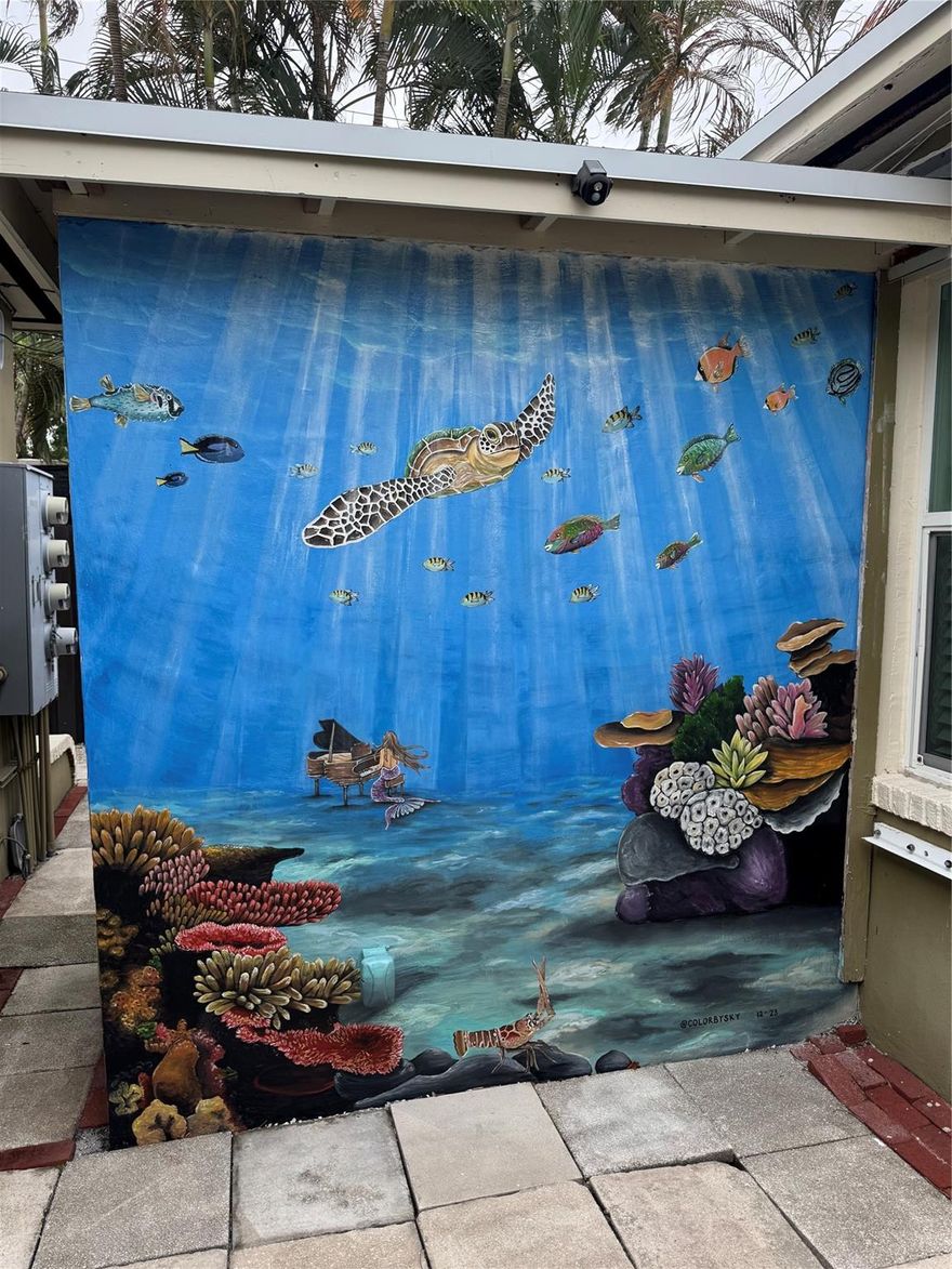 Clean, charming updated rear most unit on quiet street within walking distance of Publix and CVS. Gleaming wood floors, new modern kitchen, mini split A/C. 4 unit building fenced for privacy with lush gardens surrounding and lovely marine life mural.