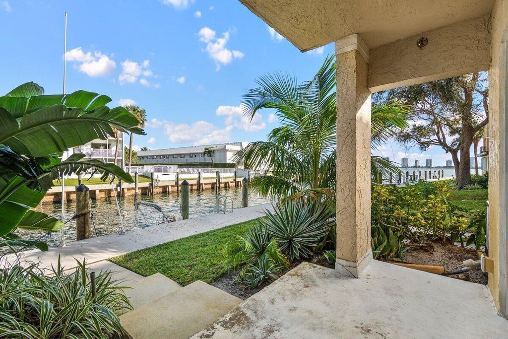 Photo of 1145 Lake Shore Drive #101, Lake Park, FL 33403 (MLS # R11051559)