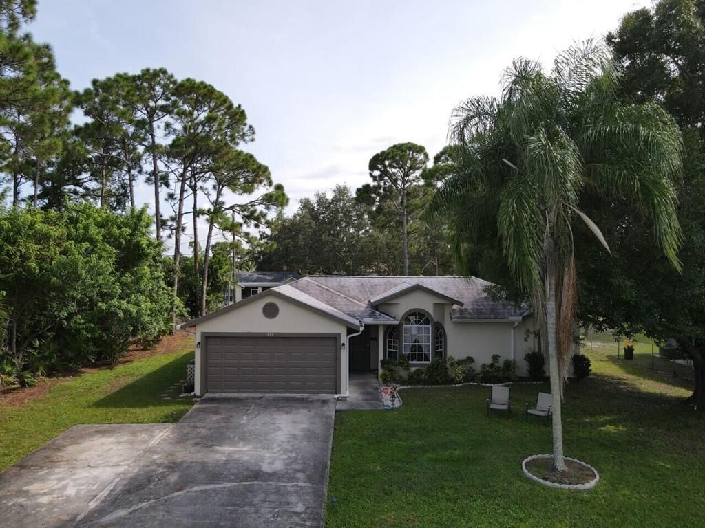 Photo of 1974 SW Del Rio Boulevard, Port Saint Lucie, FL 34953 (MLS # R10742699)