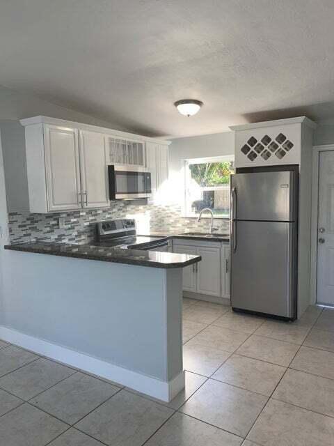 Photo of 5672 Purdy Lane, West Palm Beach, FL 33415 (MLS # B26063028)