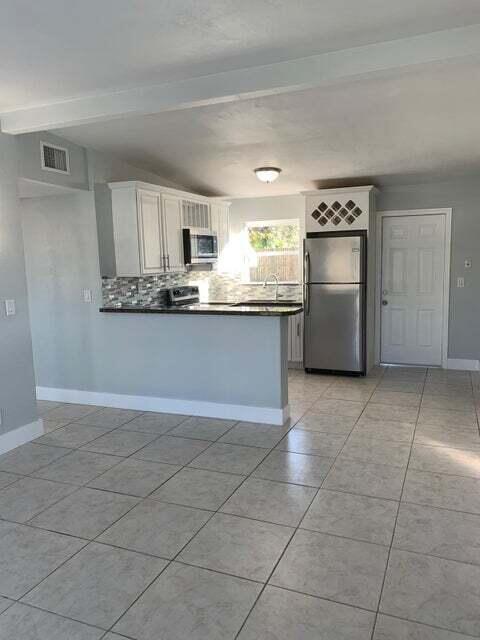 Photo of 5672 Purdy Lane, West Palm Beach, FL 33415 (MLS # B26063028)