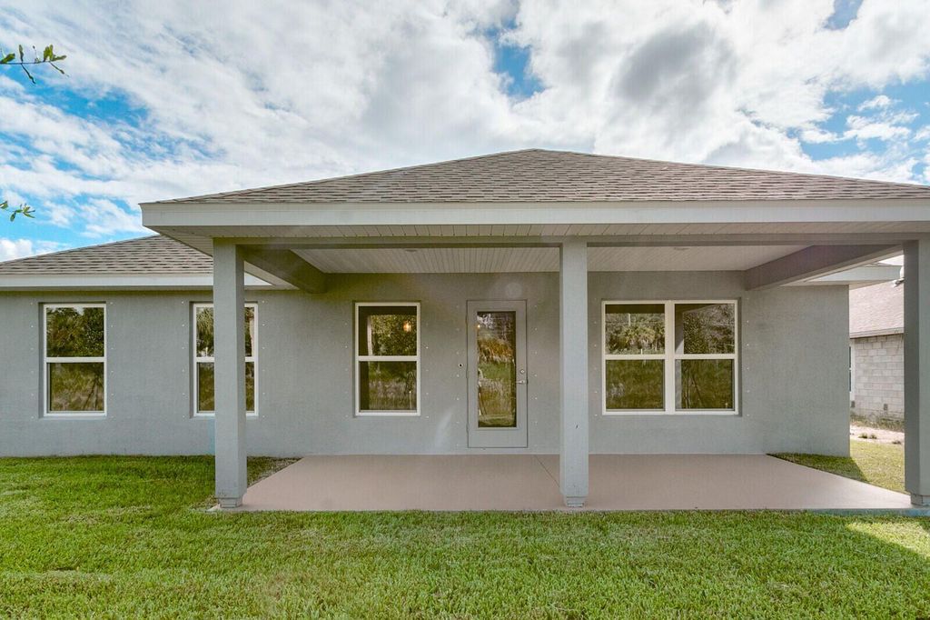 Photo of 8729 NW Pavia Street, Fort Pierce, FL 34951 (MLS # R10953342)