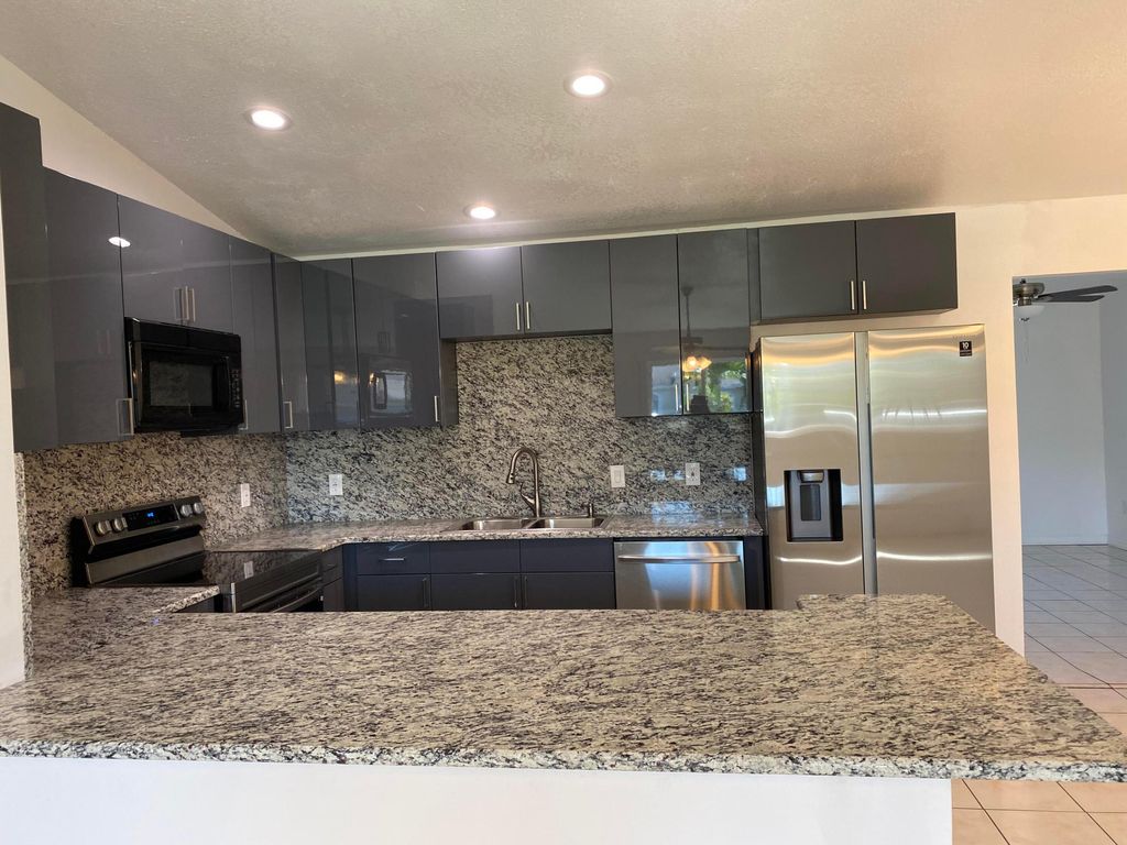 Photo of 757 NW Bayard Avenue, Port Saint Lucie, FL 34983 (MLS # R11141467)