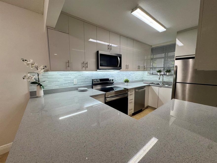This beautifully remodeled first-floor condo is move-in ready, all-ages, pets ok,no credit score, gated community just minutes from the beach, major highways, and shopping. experience the attention to detail throughout. The home features a brand-new, custom-designed kitchen equipped with high-end stainless steel appliances, perfect for both everyday living and entertaining. The air conditioning system, including all ducts, has been completely reinstalled to ensure optimal cooling and airflow year-round. Primary bedroom has an extra closet. You'll also appreciate the new flooring, fresh paint throughout, and a modern, energy-efficient tankless water heater. sewage, trash and water is included in the rent. This home checks all the boxes! Gated,pool,gym,jaccuzzi,sauna.