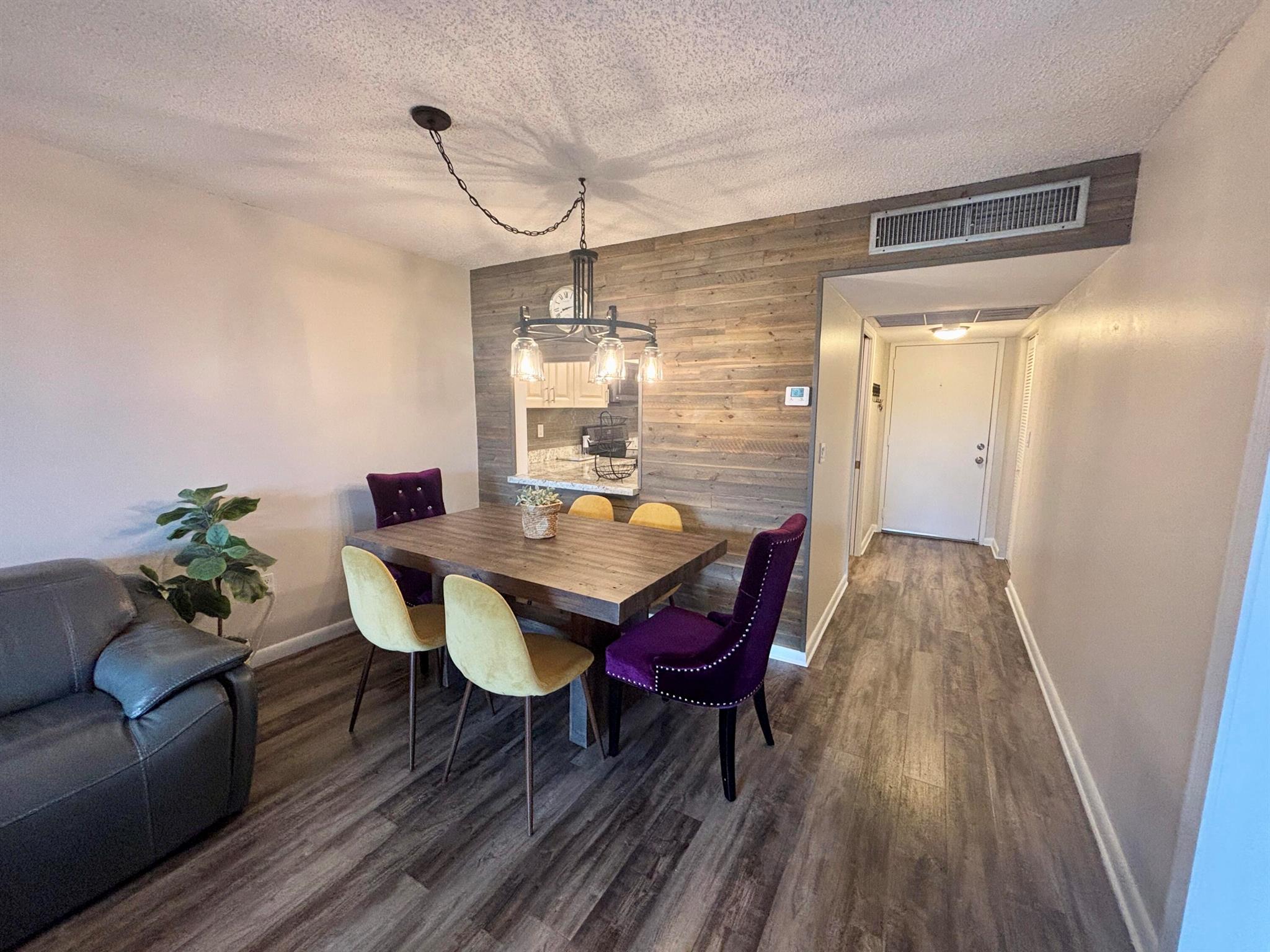 Welcome to this bright & spacious 1,100 sqft, 2/2 condo, featuring an updated kitchen with new appliances, vinyl flooring, and tons of natural light. Enjoy a screened patio with peaceful garden and water views, plus the convenience of elevators, laundry on every floor, a deeded parking spot right by the entrance, and plenty of guest parking. Residents have full access to Pine Island Ridge amenities including clubhouse, pool, fitness center, golf, tennis, pickleball, restaurants, and scenic walking trails, along with a private subdivision pool. Ideally located just minutes to I-595, Nova Southeastern University, shopping, and dining. Pet-friendly (up to 2 pets, dogs under 50 lbs). Unit is listed Partially furnished with the ability to remove any unwanted furniture.