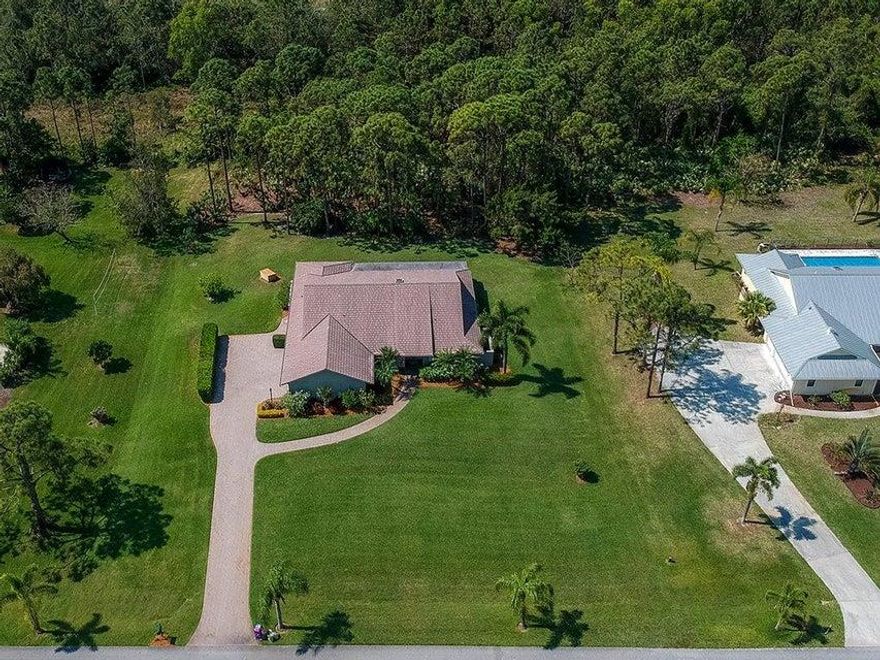 FIRST-TIME OFFERED! Welcome to your 3BR/2BA/2.5CG home on one private acre with private preserve views. Sought after split-plan showcases vaulted ceilings in your great room w/pocket sliders that open to your large screened Florida Room for plentiful room to entertain.