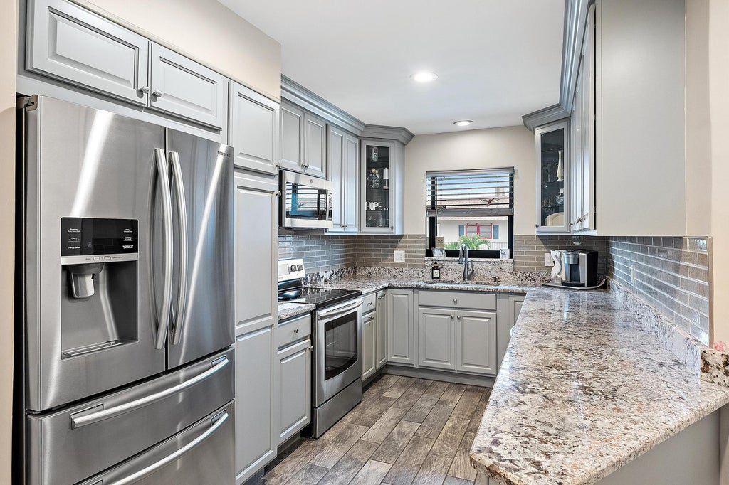 Photo of 755 Saturn Street #E203, Jupiter, FL 33477 (MLS # B26082627)