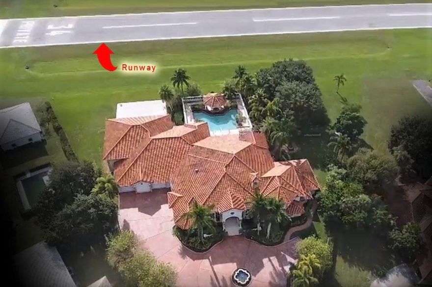 This gorgeous estate totaling 12,778sq feet is located in the Aero Club, a premier private airport community in the equestrian capitol of the world, on a million dollar piece of property with the largest direct runway frontage of any single lot in the entire Aero Club. You can lounge in the magnificent back yard with a beautiful sun set view, as you are entertained with the fantastic aircraft that takes off and lands directly behind your home. This souring estate is exquisitely designed with impeccable taste and includes every amenity possible: over size multi-plane hangar, home theater, wet-bar/game room, gym, mother-in-law house, guest suite, office, children's play room, private park, and even a craft room to name just a few. With a house this size the possibilities are endless.