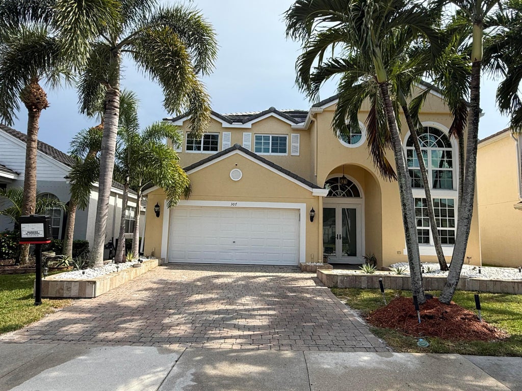 Photo of 307 BERENGER Walk, Royal Palm Beach, FL 33414 (MLS # B26060596)