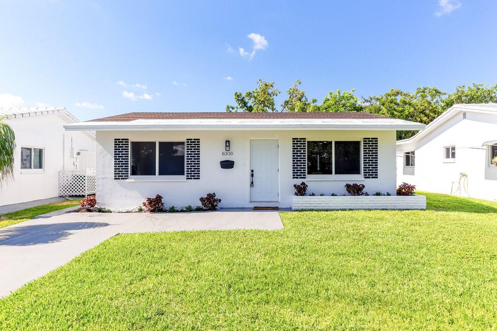 Photo of 8310 NW 59th Pl, Tamarac, FL 33321 (MLS # F10451732)