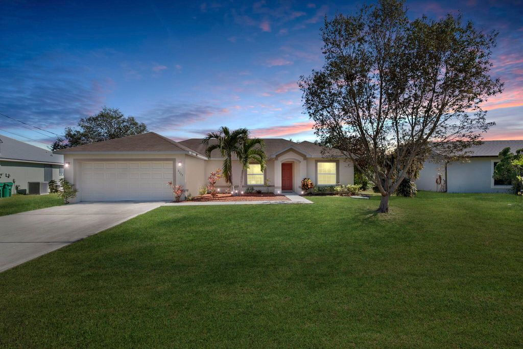 Photo of 2373 SE Rock Springs Drive, Port Saint Lucie, FL 34952 (MLS # R11160981)