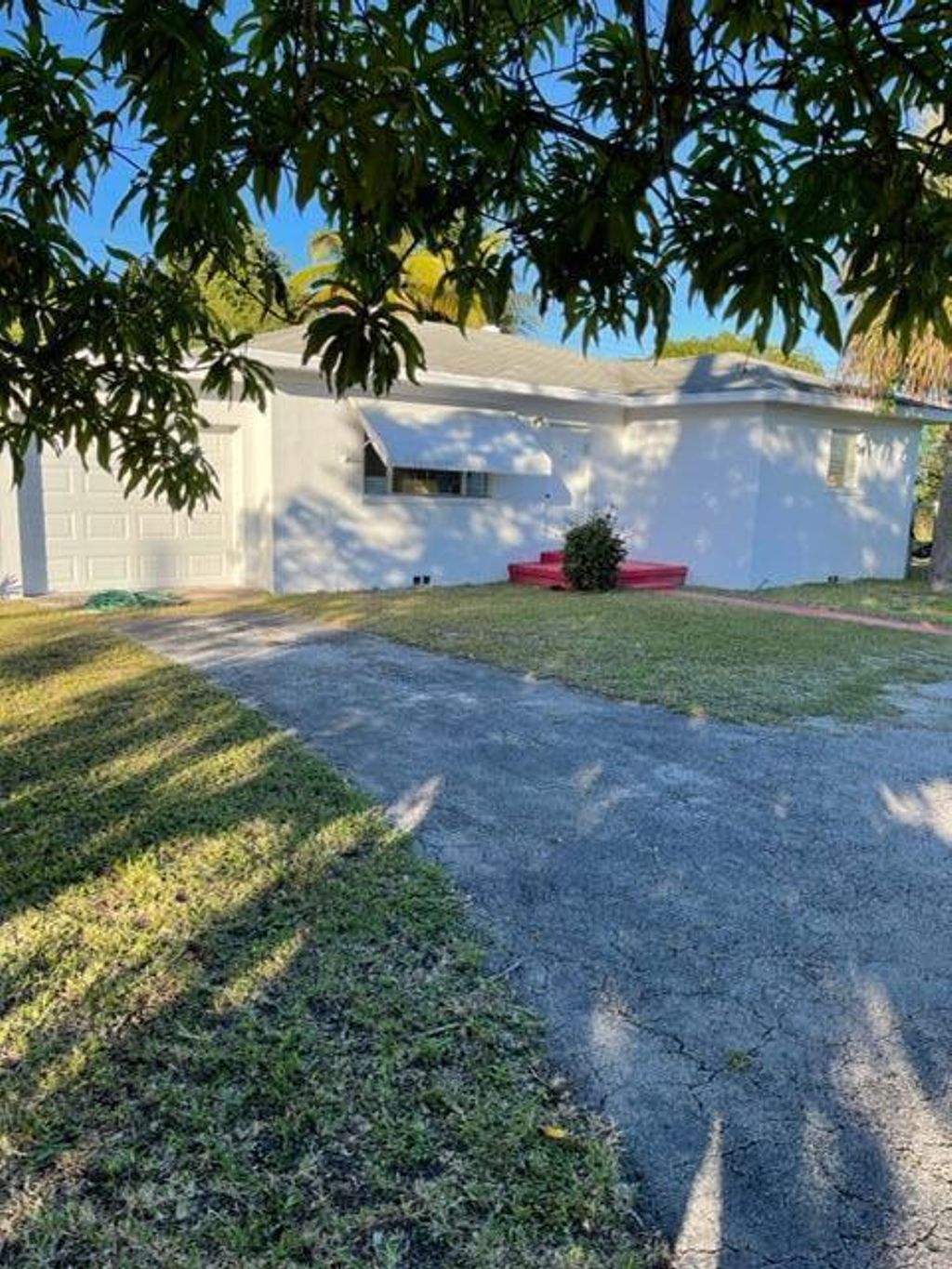 Photo of 459 Silver Beach Road, Lake Park, FL 33403 (MLS # R10773288)