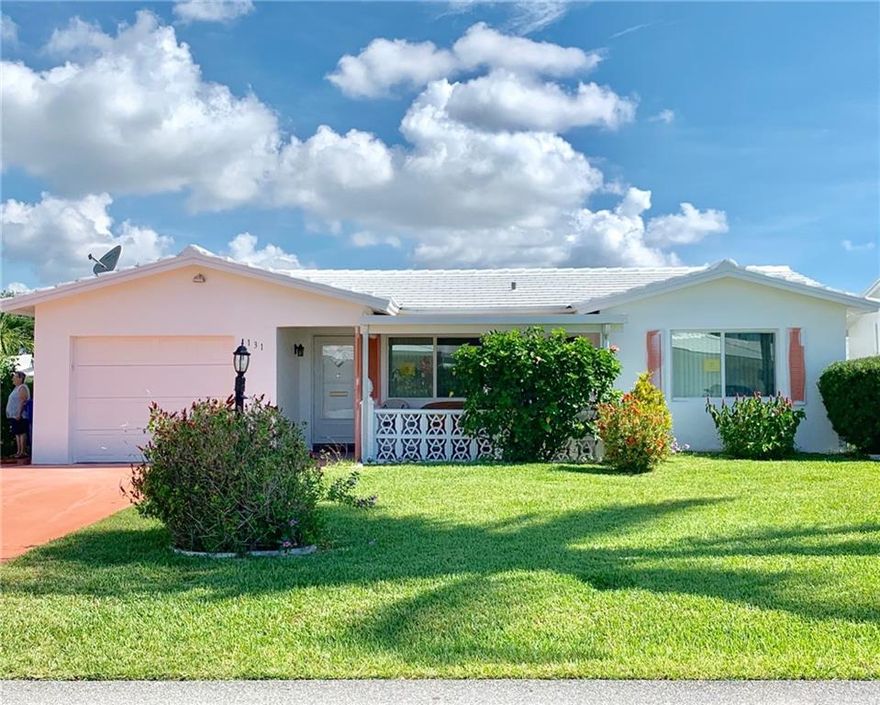 THIS INCREDIBLE 2B/2B CORNER LOT HOUSE IN LEISUREVILLE HAS A BRAND NEW ROOF INSTALLED * FRESHLY PAINTED OUTSIDE * NO LAND LEASE * TURN KEY FURNISHED * NEW IMPACT SLIDING DOORS & WINDOWS * PORCELAIN FLOORING THROUGHOUT * NEWER KITCHEN CABINETS WITH GRANITE COUNTER TOPS * PRIVATE PATIO WITH PAVERS AND B-B-Q IN BACKYARD * INTERIOR LAUNDRY ROOM * PULL DOWN STAIRS FOR STORAGE IN ATTIC * ONE CAR GARAGE AND DOUBLE DRIVEWAY * COMMUNITY OFFERS 9 HOLE GOLF COURSE, TWO CLUB HOUSE WITH HEATED POOLS, COURTESY BUS * ON SITE MANAGEMENT *  CAN LEASE RIGHT AWAY * PETS ALLOWED * CONVENIENTLY LOCATED NEAR I-95, MUNICIPAL GOLF COURSE, POMPANO  SHOPPING CITY CENTER * GREAT RESTAURANTS, ETC *  THE PLACE TO LIVE PEACEFULLY IN SOUTH FLORIDA