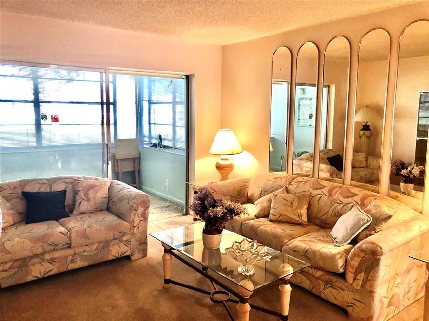 INCREDIBLY CLEAN AND SPACIOUS FIRST FLOOR CONDO IN THE DESIRABLE HOLIDAY SPRINGS VILLAGE! VERY LARGE MASTER BEDROOM FEATURES LOVELY DRESSING AREA WITH SPACIOUS WALK-IN CLOSET. LARGE EAT IN KITCHEN WITH PASS THROUGH TO FORMAL DINING ROOM.  ENCLOSED FLORIDA ROOM FOR AMPLE EXTRA LIVING SPACE.  A/C 2010.  PRICED FOR QUICK SALE.