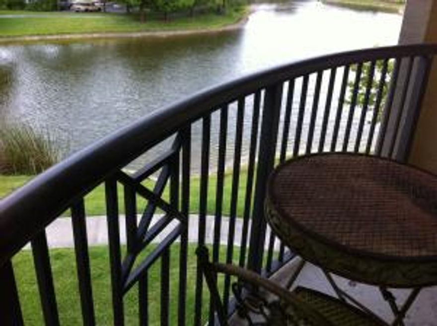 Waterfront, top floor, 2 bedrooms, 2 baths, split plan with new wood laminate floors in main area.The entire community was completely repainted in September 2015.