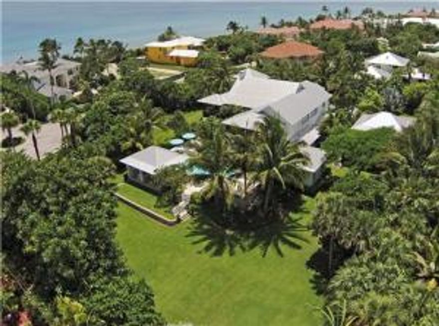 Outstanding Balinesian inspired estate with over an acre of land. Unbelievable outdoor entertainment area. Completely fenced in with great privacy. Full house generator, elevator and guest house are just a few of the amenities offered. 150 ft of private beach front is included in this sale. Both Deeds will transfer at time of closing.The information herein is deemed reliable and subject to errors, omissions or changes without notice.  The information has been derived from architectural plans or county records. Buyer should verify all measurements.Furniture for staging purposes only and is not for sale.***SEE SUPPLEMENT***