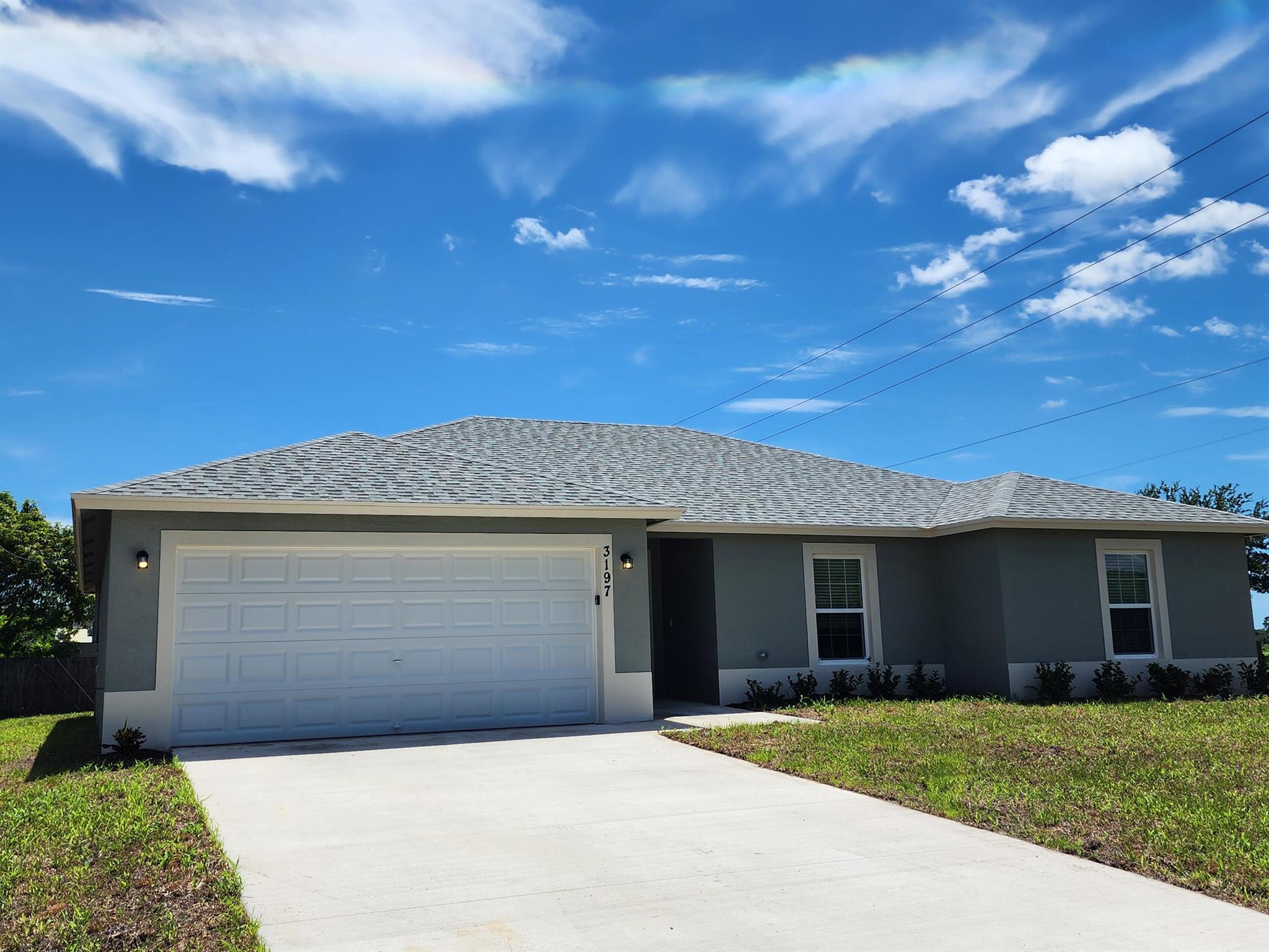 Spacious 4 BR 2 BA 2 CG rental in western PSL. Granite tops, stainless steel appliances, tile throughout.. This great location offers easy access to the state of the art Traditions medical center, shopping, schools and only minutes to I95. You are also just a short drive to the Traditions PUD, offering many dining options, shops, big box stores, and a friendly environment with that town center feel. Spectacular view of lake at Peacock Sr Park. This home has a fenced yard. First, Last and security required. Up to 2 pets may be considered with landlord approval. Max weight 25 lbs. Washer and Dryer included but not warranted..  Available starting 11/15/25.