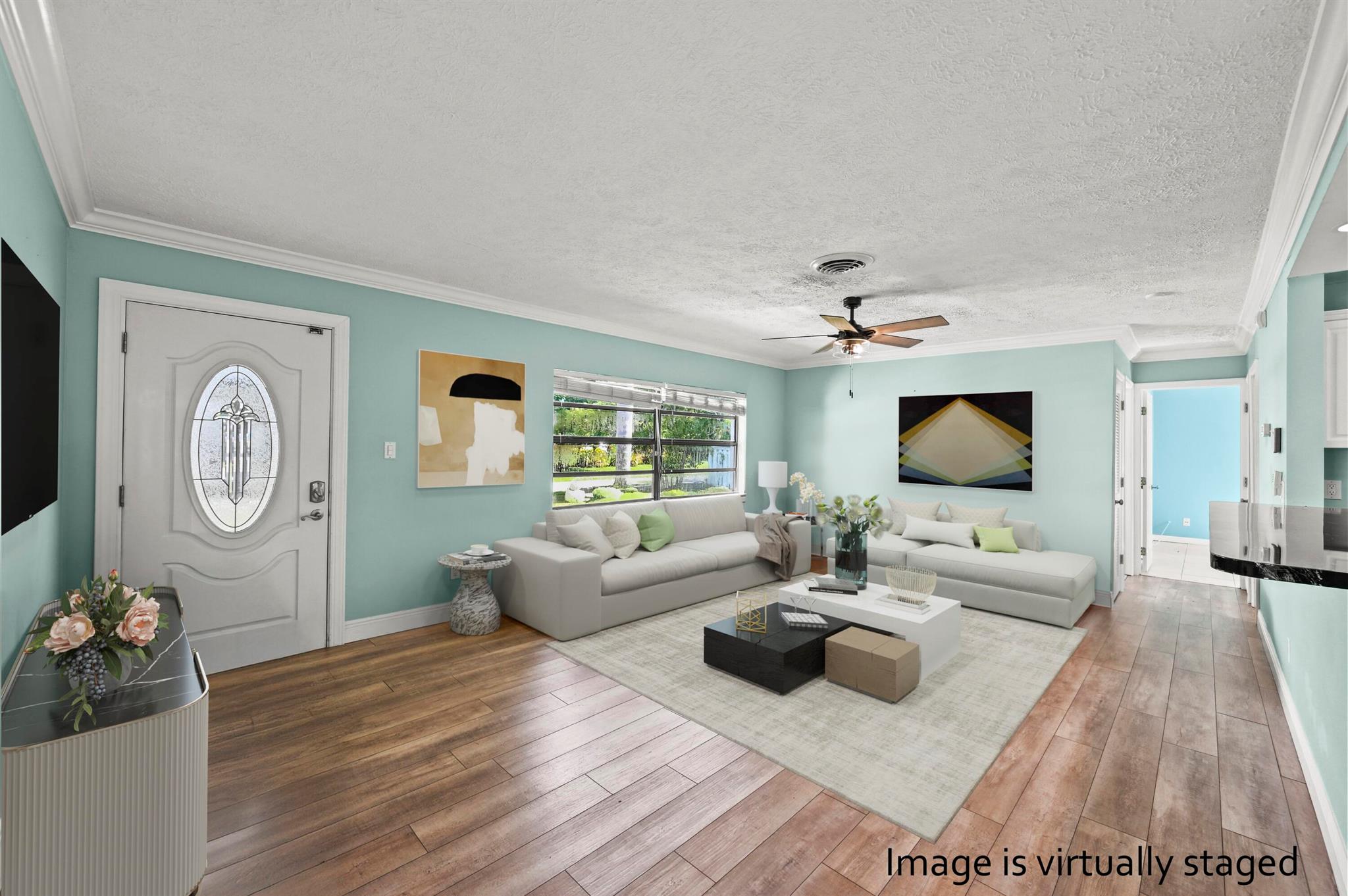 This charming residence combines comfort, convenience, and efficiency in a desirable location. You'll be close to Charlie Leighton Park, less than a mile away, with easy access to the St. Lucie River. The park has a boat launch. Set on a spacious .326-acre lot, this property offers plenty of room for all your toys. The large backyard provides possibilities for entertaining, gardening, or relaxing in your own private space. Inside, you'll find an open-concept layout enhanced with crown molding, a modern kitchen with stainless steel appliances, and comfortable living areas filled with natural light. The home features 3 bedrooms and 2 full baths.