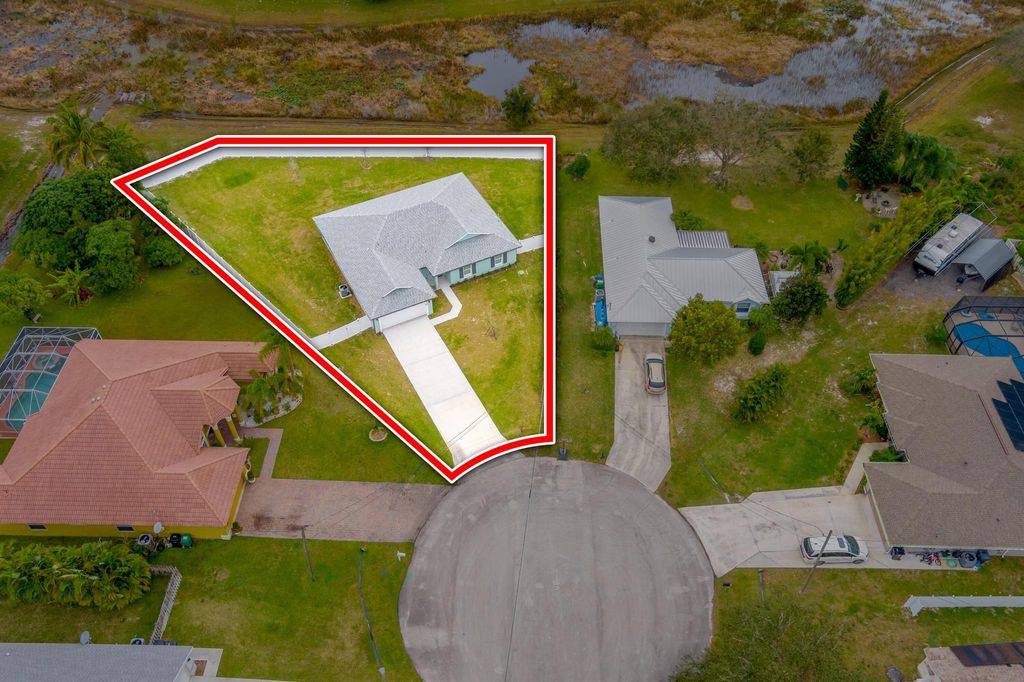 Photo of 5849 NW Alpha Court, Port Saint Lucie, FL 34986 (MLS # R10953700)