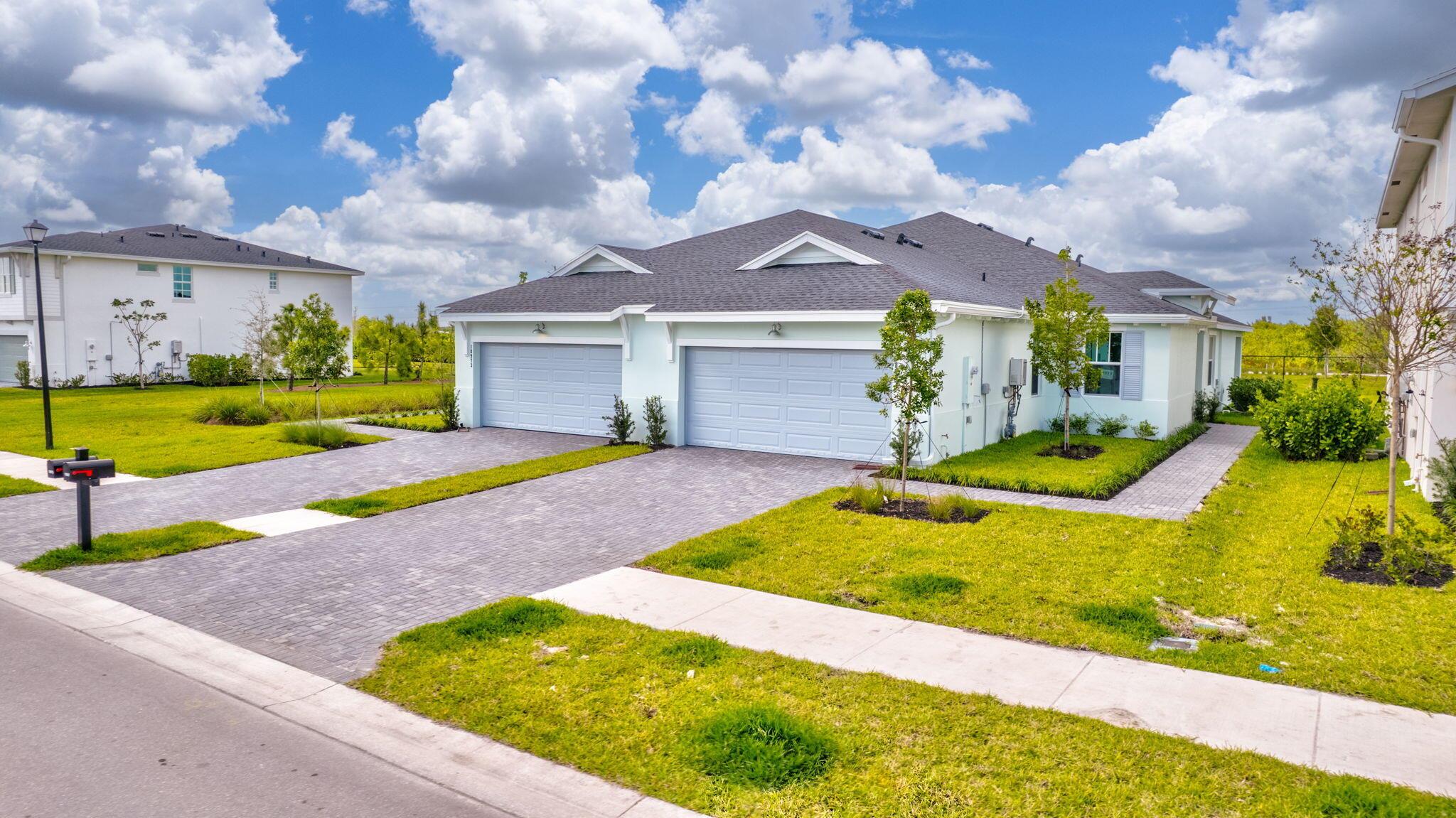 This beautifully designed single-story twin home offers a contemporary twist on a timeless layout. The open-concept floor plan seamlessly blends the stylish kitchen, inviting dining area, and spacious Great Room, creating the perfect setting for effortless living and entertaining. Sliding glass doors lead to a private lanai, extending the living space outdoors. The serene owner's suite features a walk-in closet and a well-appointed en-suite bathroom, while two additional bedrooms and a versatile flex space are thoughtfully positioned on the opposite side of the home for added privacy.''
