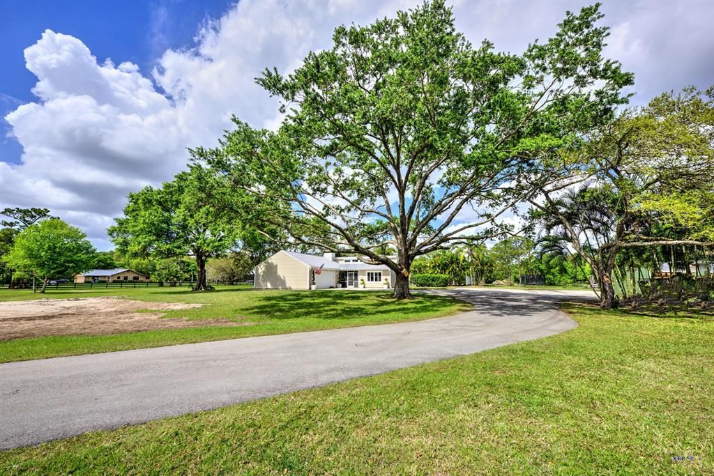 Photo of 5665 SW Woodham Street St, Palm City, FL 34990 (MLS # R10697123)