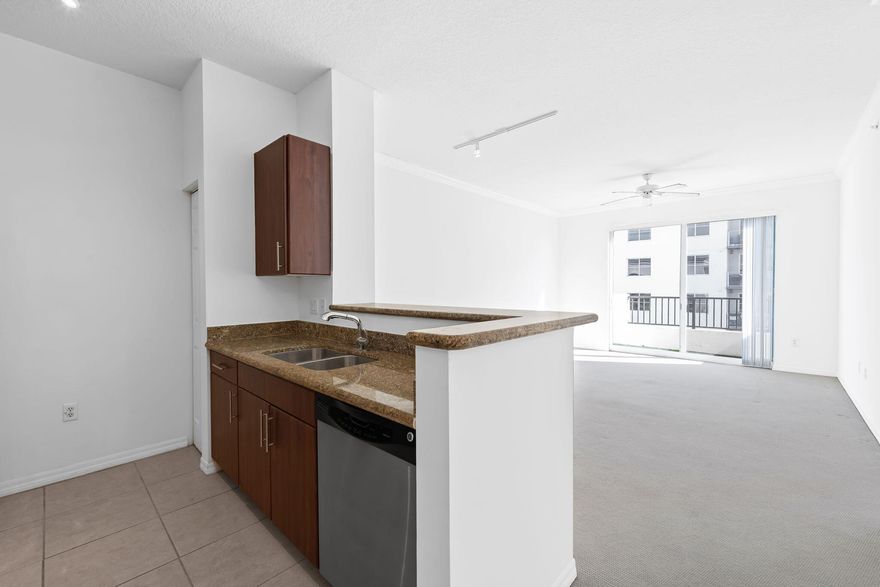 Light, bright, and unbeatable! This spacious 1-bedroom, 1-bath corner unit on the 6th floor of Lauderdale One is a rare find. Penthouse Level! Boasting bountiful natural light, its airy vibe is complemented by a full kitchen, in-unit washer and dryer, and assigned parking in the building's gated garage. Conveniently located near the elevator, this is the best-priced unit in the building—offering incredible value in a prime location. Enjoy access to the community pool and impeccably maintained common areas, all while being just minutes from Pompano beach, Lauderdale By The Sea, Fort Lauderdale Beach, fantastic shops, dining, and only 8 minutes to I-95. Don't miss out—this one won't last long!