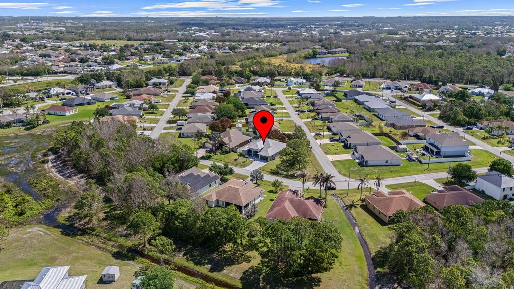 Photo of 5445 NW Briscoe Drive, Port Saint Lucie, FL 34986 (MLS # B26020114)