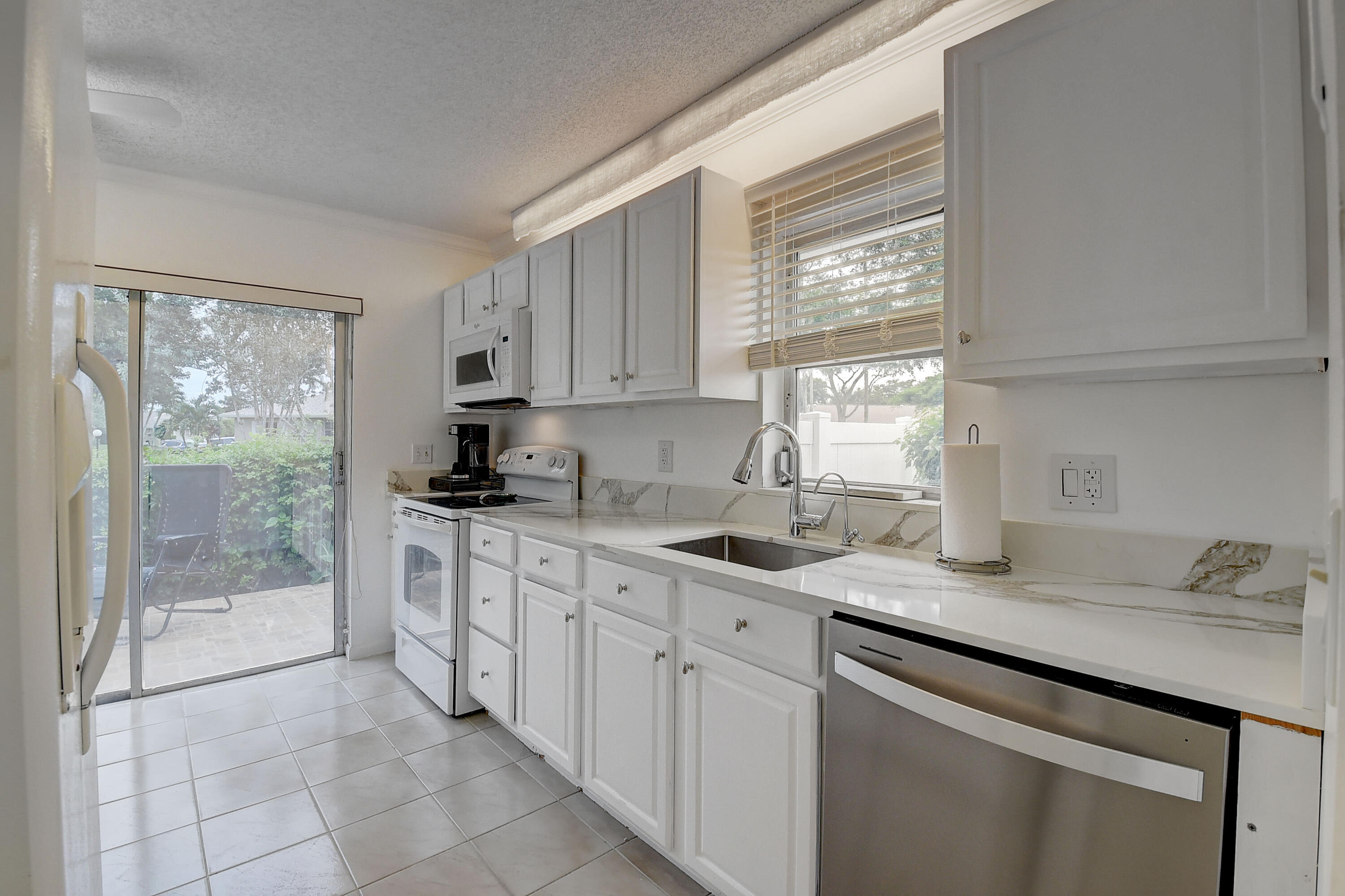 This bright and spacious, 2/2 villa is located in the coveted Whisper Walk community. The home has large bedrooms and a walk-in closet, an enclosed Florida room, and a spacious outdoor patio. This inviting, move in ready home has 2 recently updated full bathrooms. The kitchen is flooded with natural light and recent upgrades. This active 55+ community has something for everyone! The clubhouse has an over-sized pool, shuffleboard, tennis and a variety of social activities. The well maintained community also features walking paths throughout. The community is close to all shopping and dining.