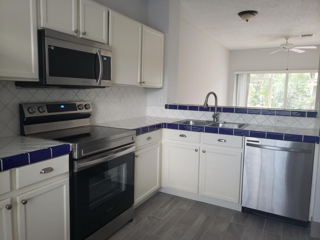 Photo of 6945 Stoney Creek Circle #6945, Lake Worth, FL 33467 (MLS # R10984424)